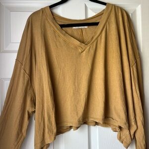 Mustard colored free people long sleeve crop shirt